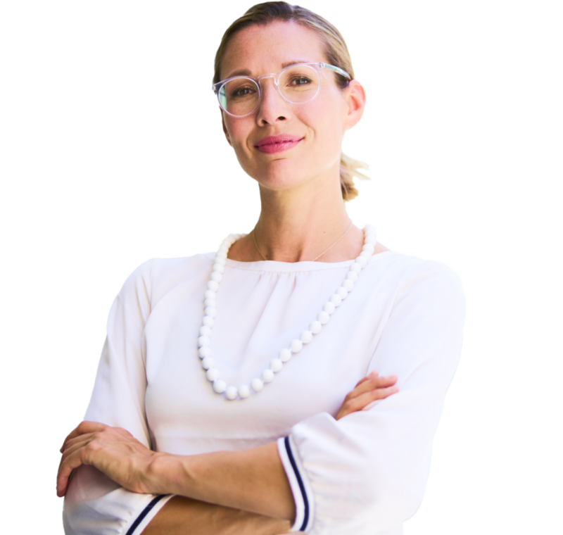 A senior living executive in a white sweater crossing her arms against a transparent background.